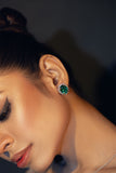 A pair of sparkling diamond stud green earrings set